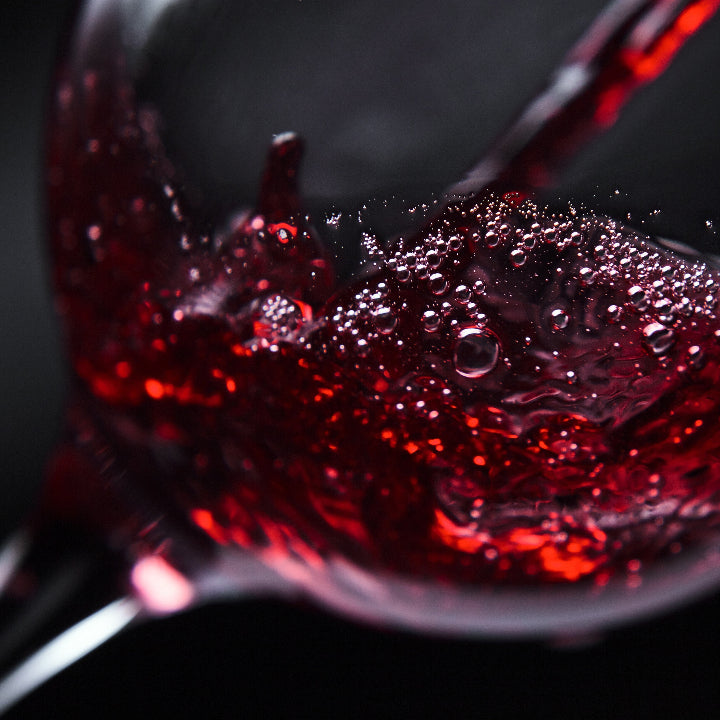 A glass of Bezalel estate wine poured at the tasting room counter