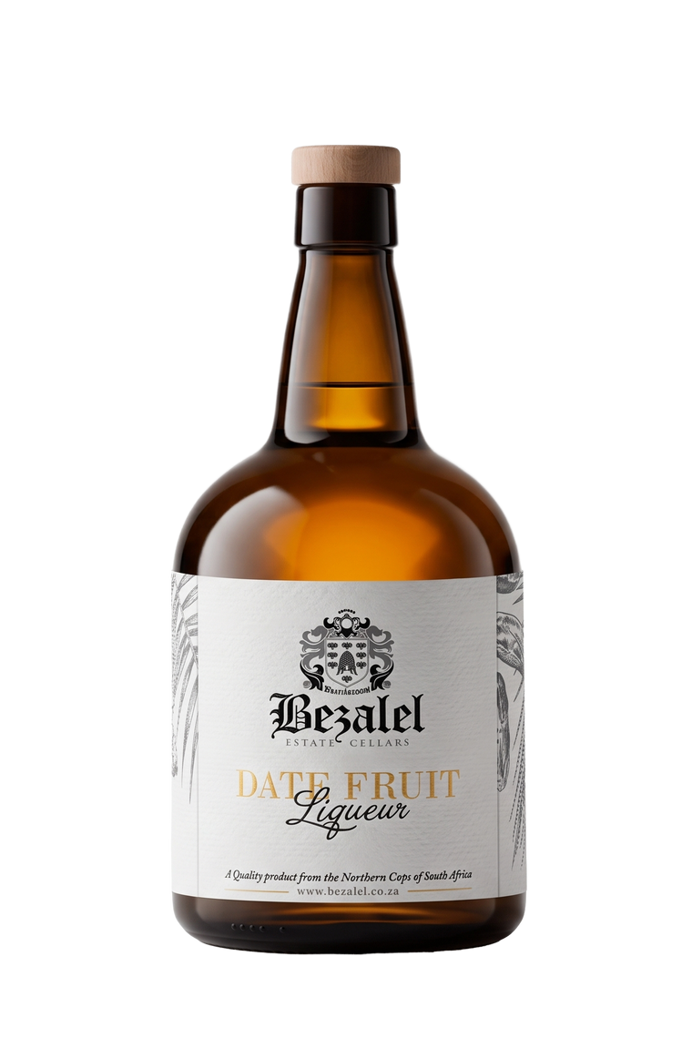 A bottle of Bezalel Date Fruit Liqueur on a solid white background. The bottle is made of amber glass, has a light tan cork stopper, and a white label with black and gold text.