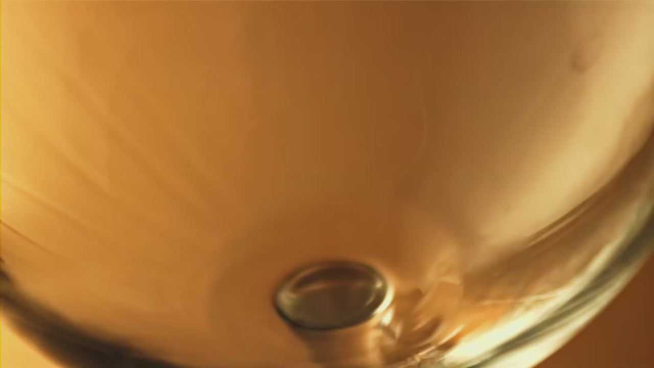 Golden colored Potstill Brandy being poured into a cognac glass at Bezalel Estate's Tasting Room