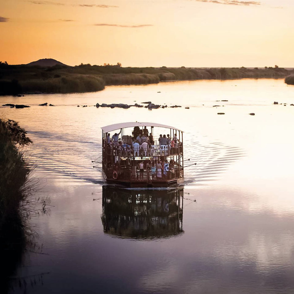 Boat with passengers on the orange river in Upington at sunset